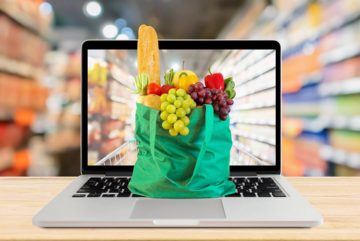 bag-full-of-groceries-sitting-on-a-laptop-keyboard